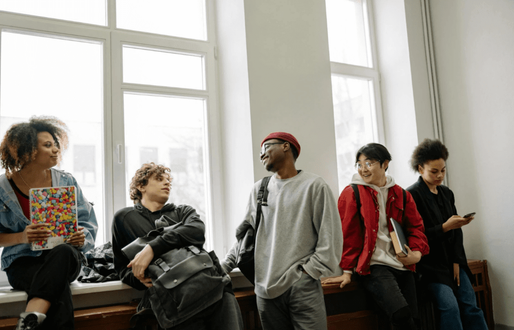 A group conversation with one person being interrupted or corrected