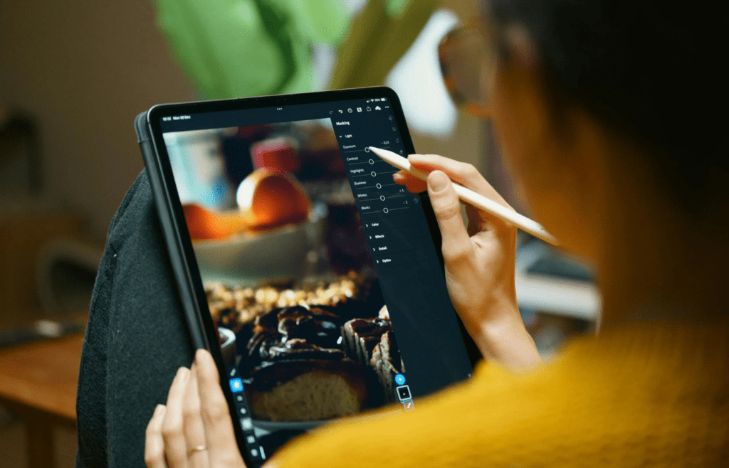 Designer Editing Photos on Tablet