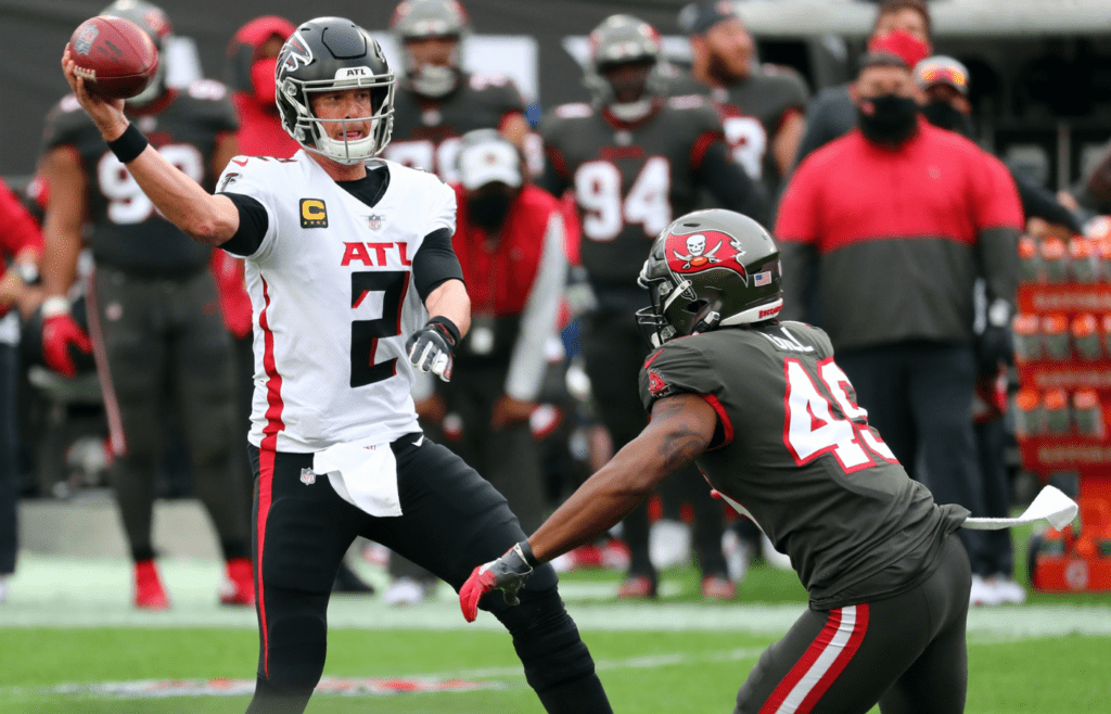 Jan 3, 2021; Tampa, Florida, USA; Atlanta Falcons quarterback Matt Ryan (2) throws the ball as Tampa Bay Buccaneers linebacker Cam Gill (49) pressures during the second half at Raymond James Stadium. Mandatory Credit: Kim Klement-Imagn Images