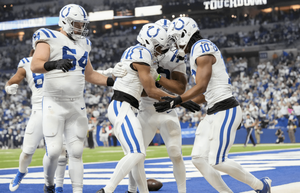 Dec 22, 2024; Indianapolis, Indiana, USA; Indianapolis Colts wide receiver Josh Downs (1) celebrates after rushing for a touchdown during a game against the Tennessee Titans at Lucas Oil Stadium. Mandatory Credit: Grace Hollars/USA Today Network via Imagn Images