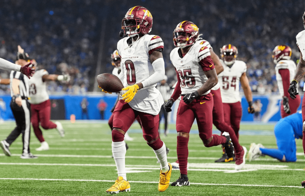 Washington Commanders cornerback Mike Sainristil (0) celebrates an interception against Detroit Lions during the first half of the NFC divisional round at Ford Field in Detroit on Saturday, Jan. 18, 2025.
