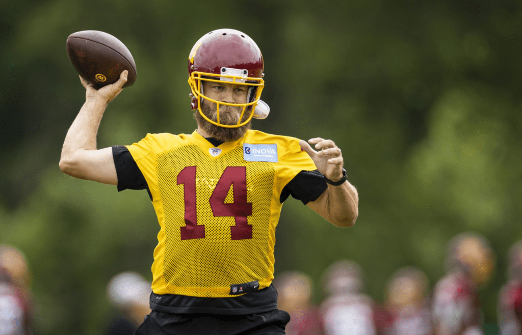 May 25, 2021; Ashburn, Virginia, USA; Washington Football Team quarterback Ryan Fitzpatrick (14) attempts a pass during an OTA at Inova Sports Performance Center. Mandatory Credit: Scott Taetsch-Imagn Images
