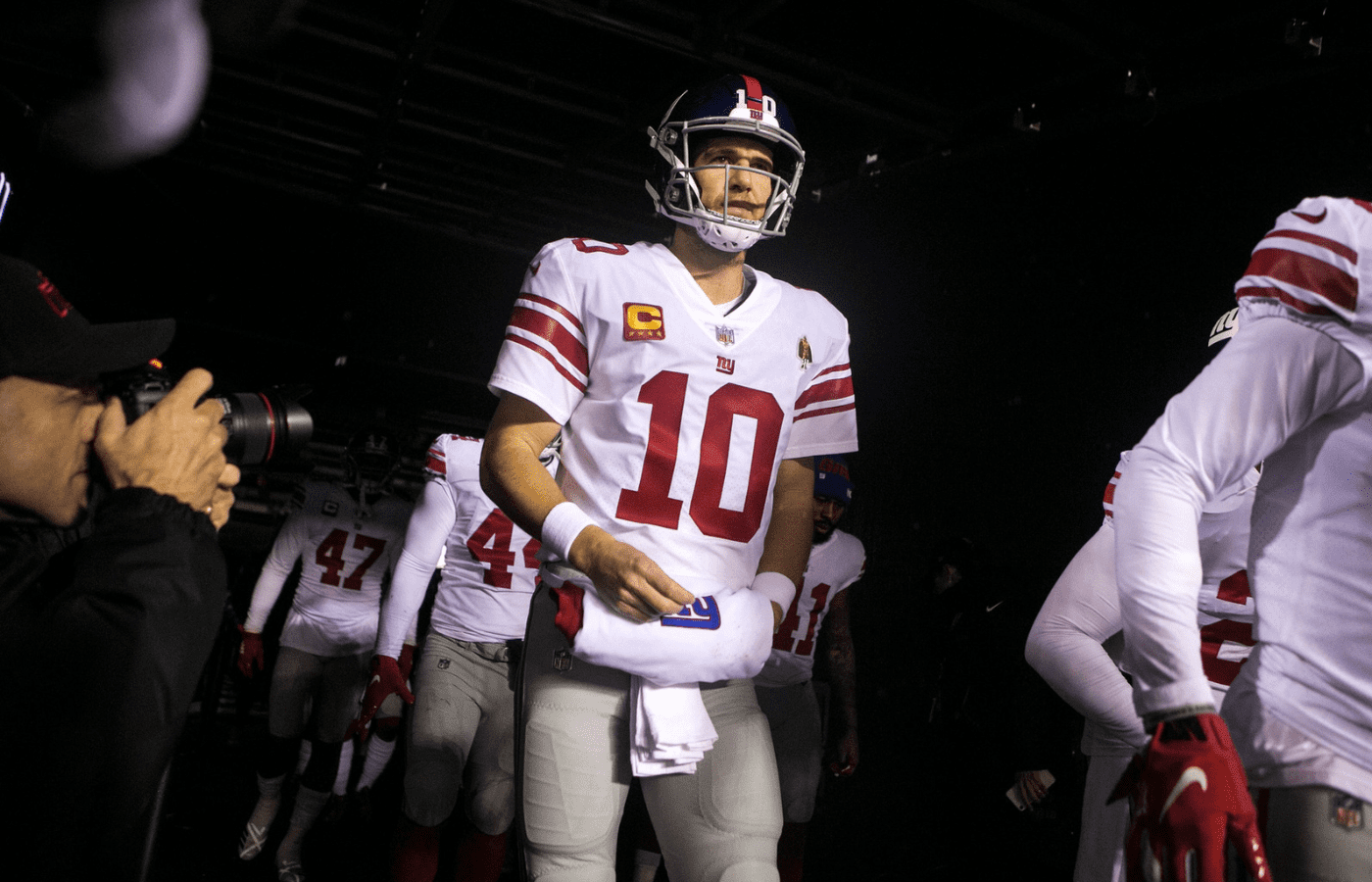 New York's Eli Manning walks out of the tunnel Monday night against the Eagles. The Eagles defeated the Giants in overtime 23-17. Sports Eagles Giants
