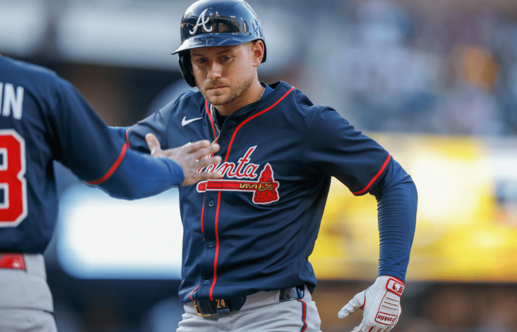 Mar 29, 2025; San Diego, California, USA; Atlanta Braves right fielder Jarred Kelenic (24) celebrates with Atlanta Braves first Base coach Tom Goodwin (88) after hitting a single during the fifth inning against the San Diego Padresat Petco Park. Mandatory Credit: David Frerker-Imagn Images
