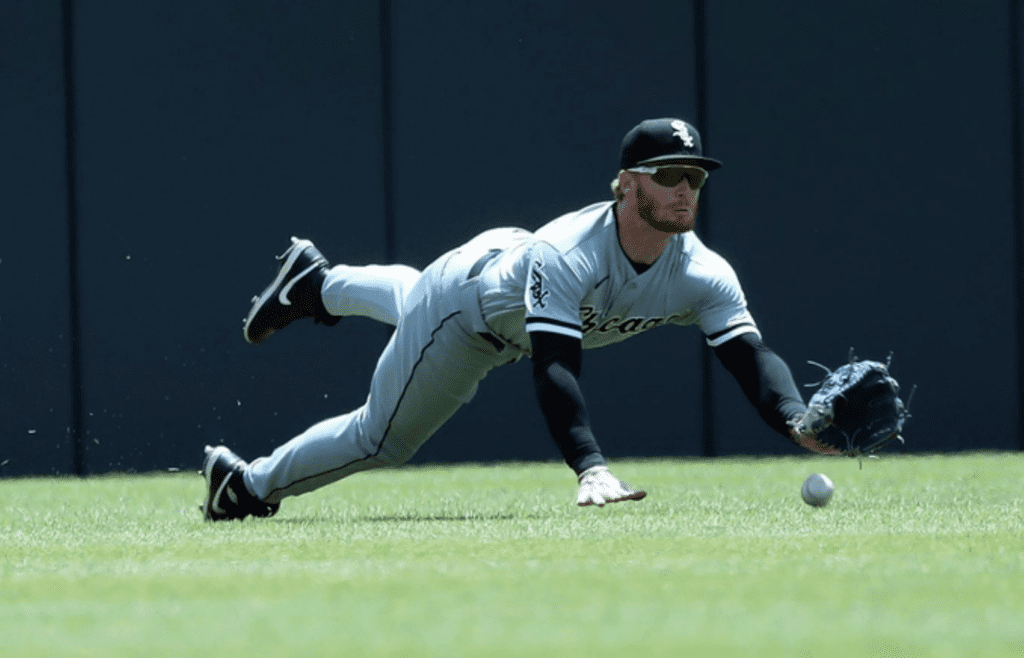 Chicago White Sox outfielder Clint Frazier dives for a fly ball hit by Detroit Tigers left fielder Akil Baddoo (60) during second-inning action Saturday, May 27, 2023 at Comerica Park in Detroit.