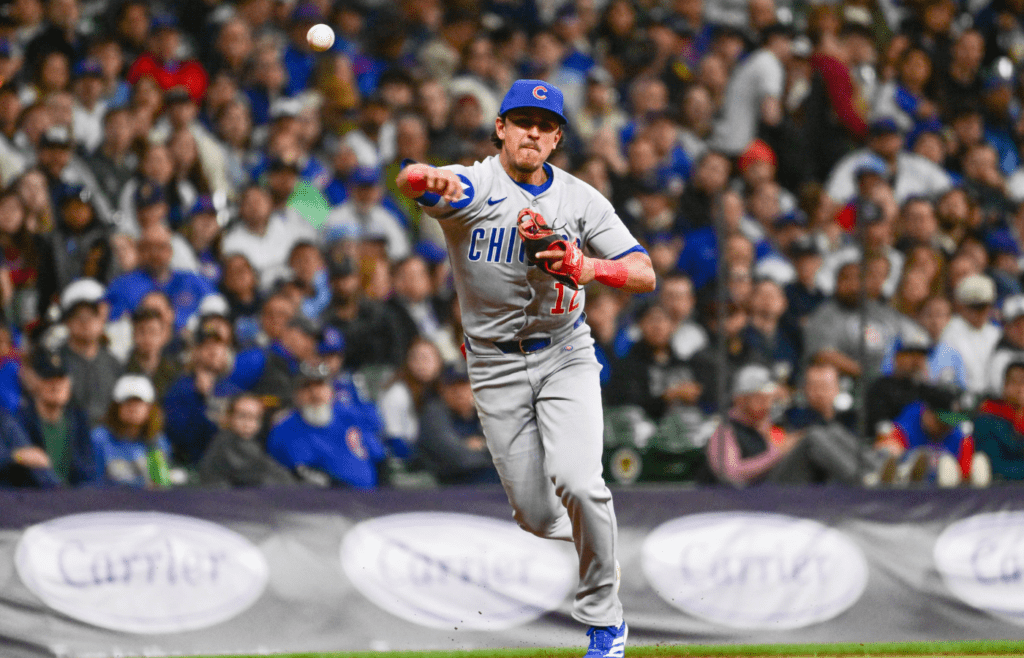 May 2, 2025; Milwaukee, Wisconsin, USA; Chicago Cubs third baseman Nicky Lopez (12) throws out Milwaukee Brewers center fielder Jackson Chourio (not pictured) in the third inning at American Family Field. Mandatory Credit: Benny Sieu-Imagn Images