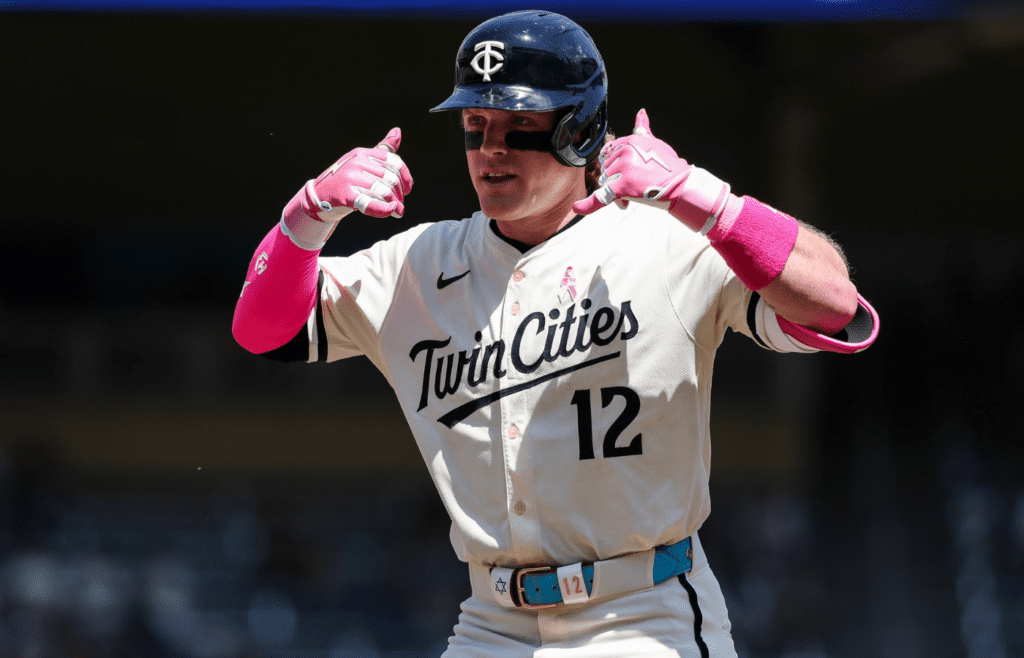 May 11, 2025; Minneapolis, Minnesota, USA; Minnesota Twins left fielder Harrison Bader (12) celebrates his single against the San Francisco Giants during the third inning at Target Field. Mandatory Credit: Matt Krohn-Imagn Images