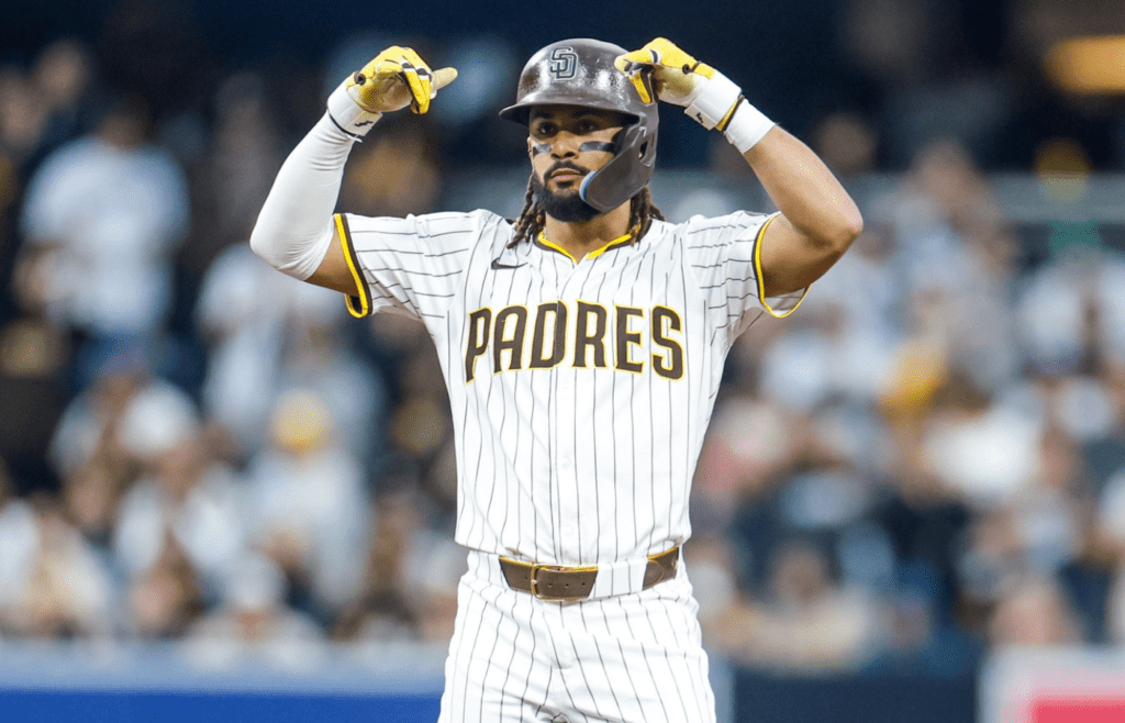 May 17, 2025; San Diego, California, USA; San Diego Padres right fielder Fernando Tatis Jr. (23) celebrates with the dugout after hitting a double during the fifth inning against the Seattle Mariners at Petco Park. Mandatory Credit: David Frerker-Imagn Images