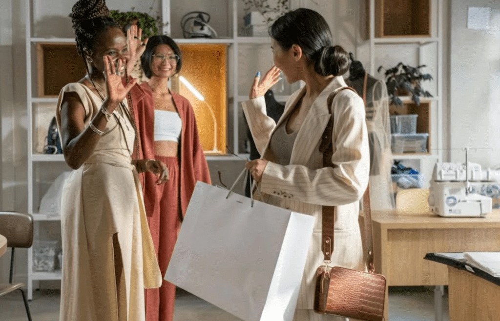 A person shopping with designer bags after getting a paycheck
