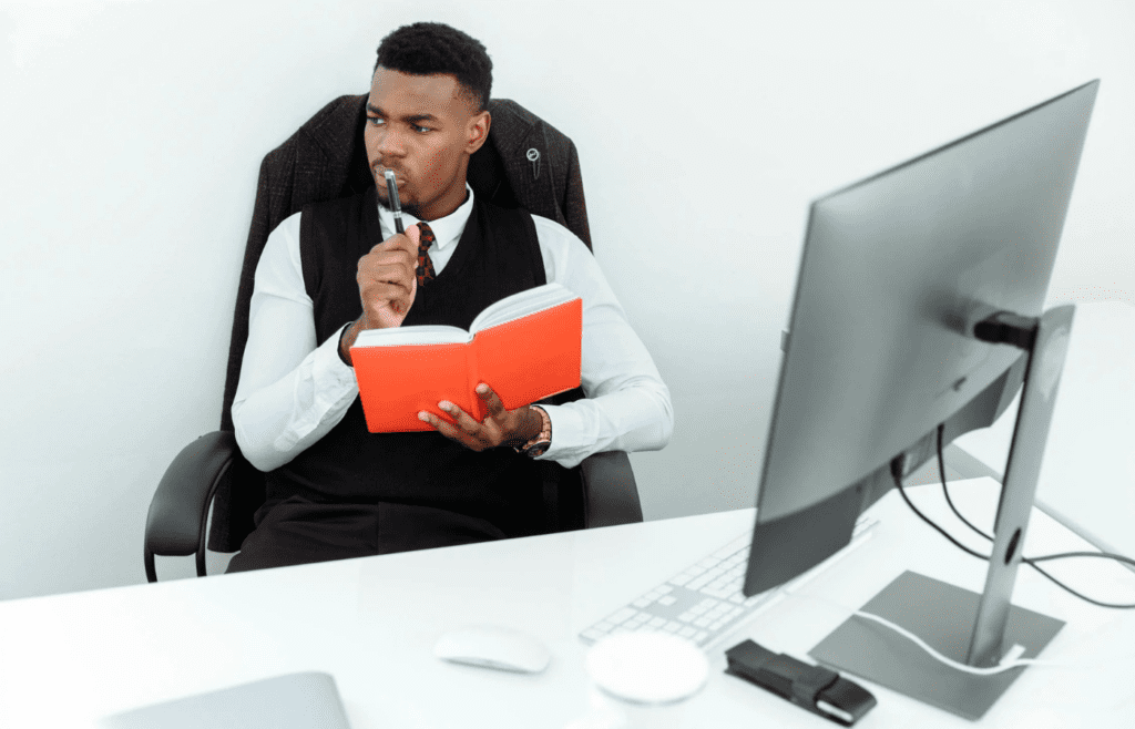 A person smugly looking at a perfectly organized desk