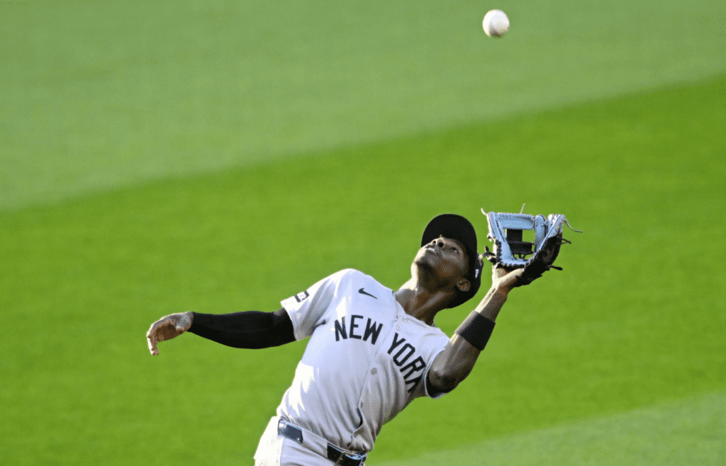 Apr 22, 2025; Cleveland, Ohio, USA; New York Yankees second baseman Jazz Chisholm Jr. (13) makes a catch in the fourth inning against the Cleveland Guardians at Progressive Field. Mandatory Credit: David Richard-Imagn Images