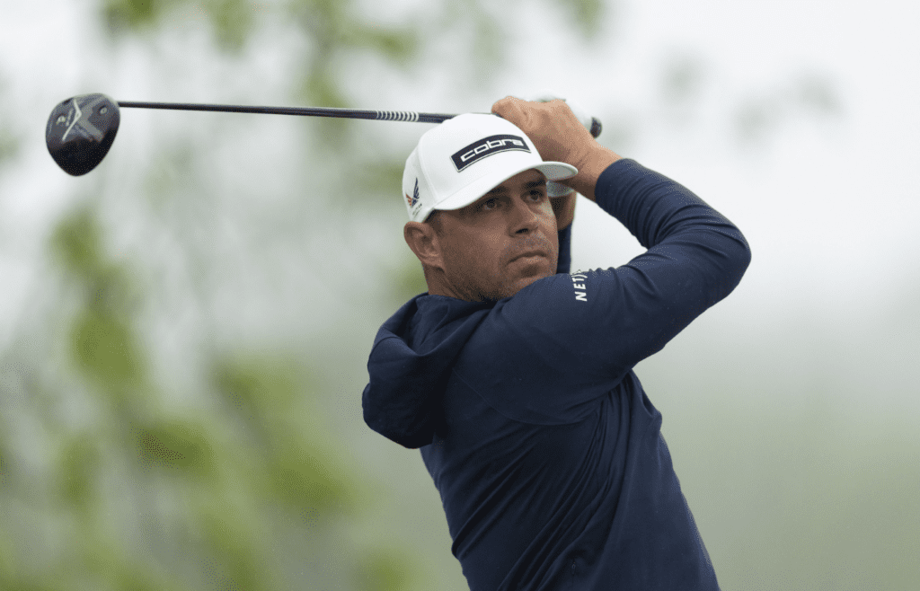 May 9, 2025; Philadelphia, Pennsylvania, USA; Gary Woodland plays his shot from the first tee during the second round of the Truist Championship golf tournament. Mandatory Credit: Bill Streicher-Imagn Images