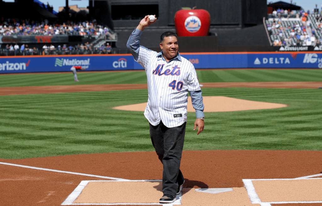 Sep 17, 2023; New York City, New York, USA; New York Mets former pitcher Bartolo Colon waves after throwing out a ceremonial first pitch before a game against the Cincinnati Reds at Citi Field. Colon today retired from baseball as a Met. Mandatory Credit: Brad Penner-Imagn Images