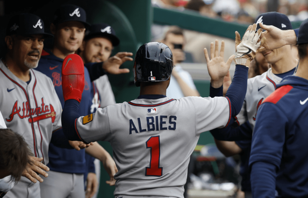 May 20, 2025; Washington, District of Columbia, USA; Atlanta Braves second baseman Ozzie Albies (1) celebrates with teammates after scoring a run against the Washington Nationals during the second inning at Nationals Park. Mandatory Credit: Geoff Burke-Imagn Images