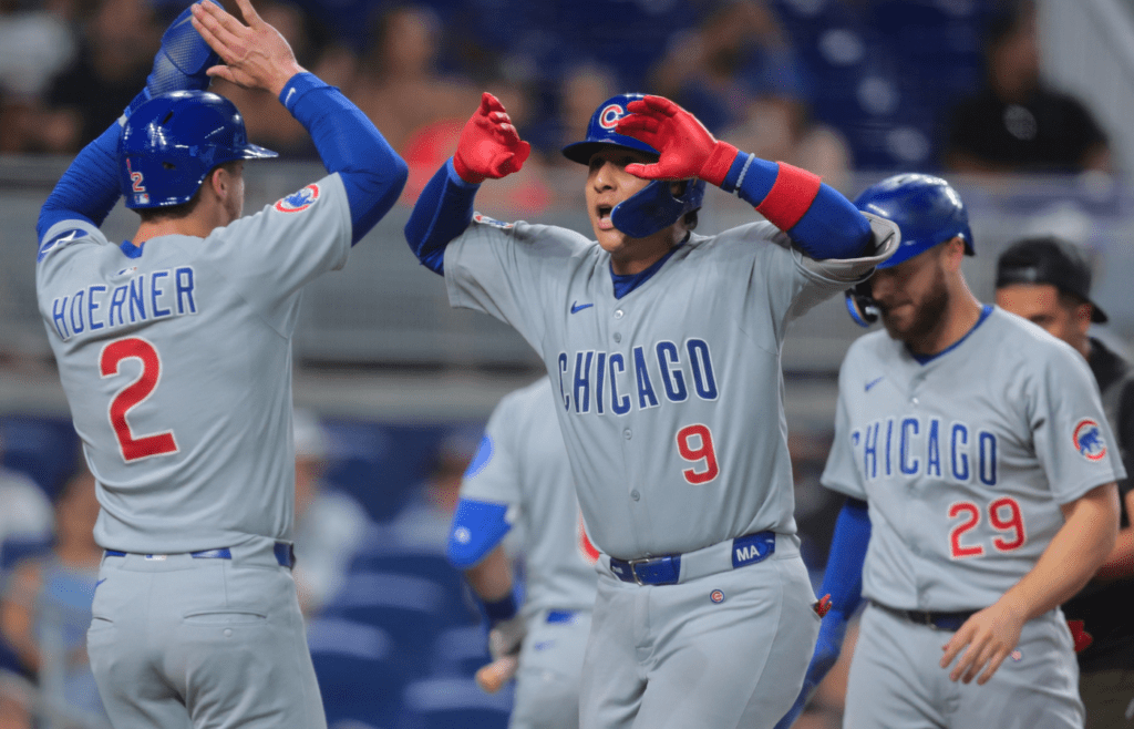 May 19, 2025; Miami, Florida, USA; Chicago Cubs catcher Miguel Amaya (9) celebrates with second baseman Nico Hoerner (2) after hitting a three-run home run against the Miami Marlins during the fourth inning at loanDepot Park. Mandatory Credit: Sam Navarro-Imagn Images