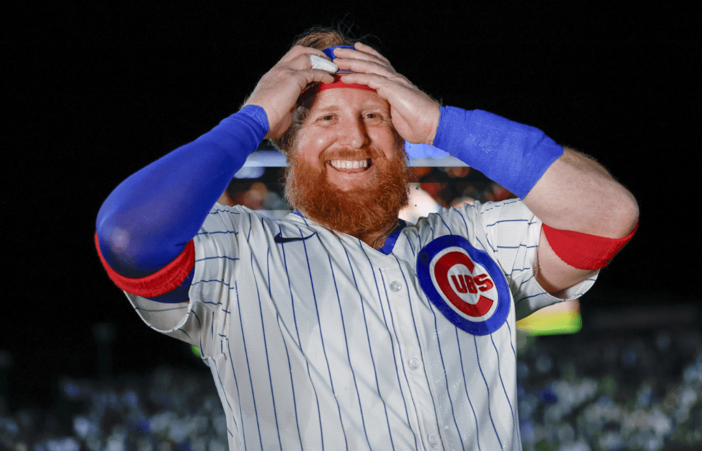 May 13, 2025; Chicago, Illinois, USA; Chicago Cubs first baseman Justin Turner (3) smiles after hitting a walk-off two-run double against the Miami Marlins during the ninth inning at Wrigley Field. Mandatory Credit: Kamil Krzaczynski-Imagn Images