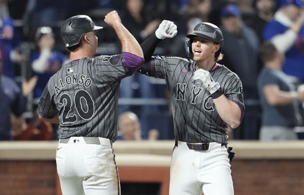 May 10, 2025; New York City, New York, USA; New York Mets first baseman Pete Alonso (20) congratulates New York Mets third baseman Brett Baty (7) for hitting a three run home run against the Chicago Cubs during the fourth inning at Citi Field. Mandatory Credit: Gregory Fisher-Imagn Images