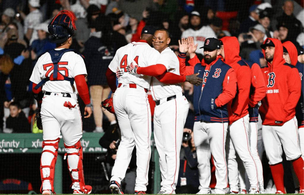 May 19, 2025; Boston, Massachusetts, USA; Boston Red Sox designated hitter Rafael Devers (11) celebrates beating the New York Mets with relief pitcher Aroldis Chapman (44) at Fenway Park. Mandatory Credit: Eric Canha-Imagn Images