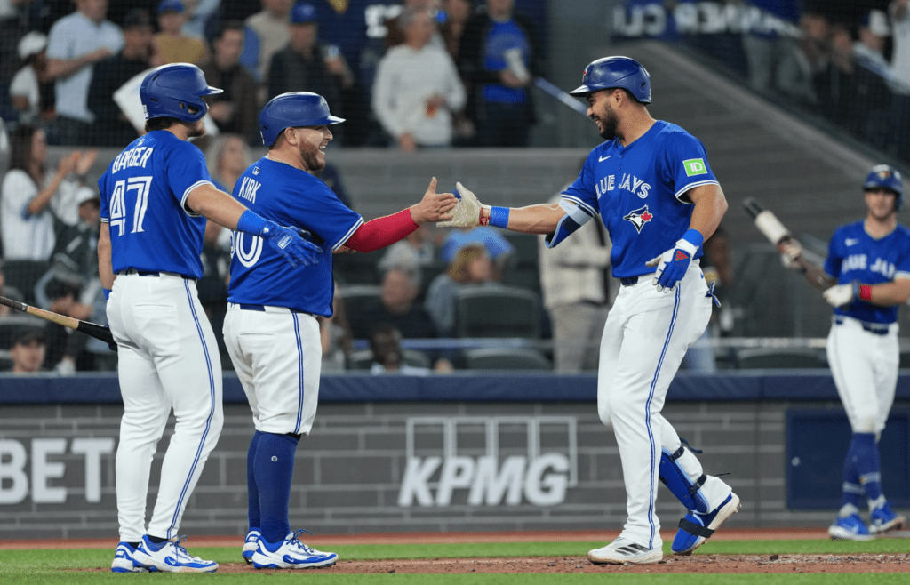 May 20, 2025; Toronto, Ontario, CAN; Toronto Blue Jays designated hitter Anthony Santander (25) hits a two-run home run and celebrates with catcher Alejandro Kirk (30) against the San Diego Padres during the fifth inning at Rogers Centre. Mandatory Credit: Nick Turchiaro-Imagn Images