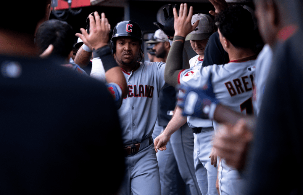 Cleveland Guardians third baseman Jose Ramirez (11) high fives players after hitting a solo home run in the eighth inning of the MLB game between Cincinnati Reds and Cleveland Guardians at Great American Ball Park in Cincinnati on Friday, May 16, 2025.
