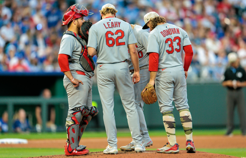 May 17, 2025; Kansas City, Missouri, USA; St. Louis Cardinals meet on the mound during the eighth inning against the Kansas City Royals at Kauffman Stadium. Mandatory Credit: William Purnell-Imagn Images