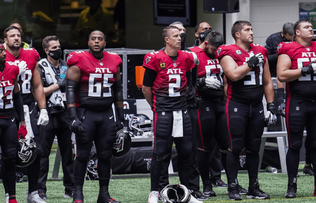 Oct 25, 2020; Atlanta, Georgia, USA; Players shown during the national anthem prior to the game between the Detroit Lions against the Atlanta Falcons during the at Mercedes-Benz Stadium. Mandatory Credit: Dale Zanine-Imagn Images
