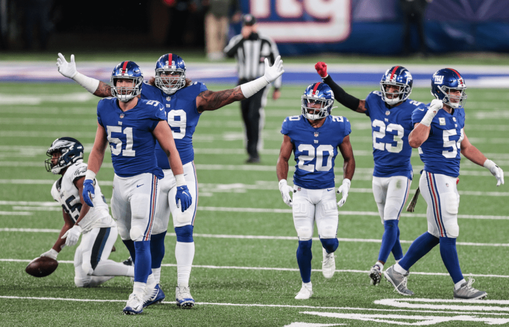 Nov 15, 2020; East Rutherford, New Jersey, USA; New York Giants linebacker Kyler Fackrell (51) and defensive end Leonard Williams (99) and cornerback Julian Love (20) and cornerback Logan Ryan (23) and linebacker Blake Martinez (54) celebrate a defensive stop during the fourth quarter at MetLife Stadium. Mandatory Credit: Vincent Carchietta-Imagn Images