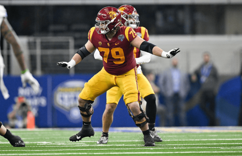 Jan 2, 2023; Arlington, Texas, USA; USC Trojans offensive lineman Jonah Monheim (79) in action during the game between the USC Trojans and the Tulane Green Wave in the 2023 Cotton Bowl at AT&T Stadium. Mandatory Credit: Jerome Miron-Imagn Images