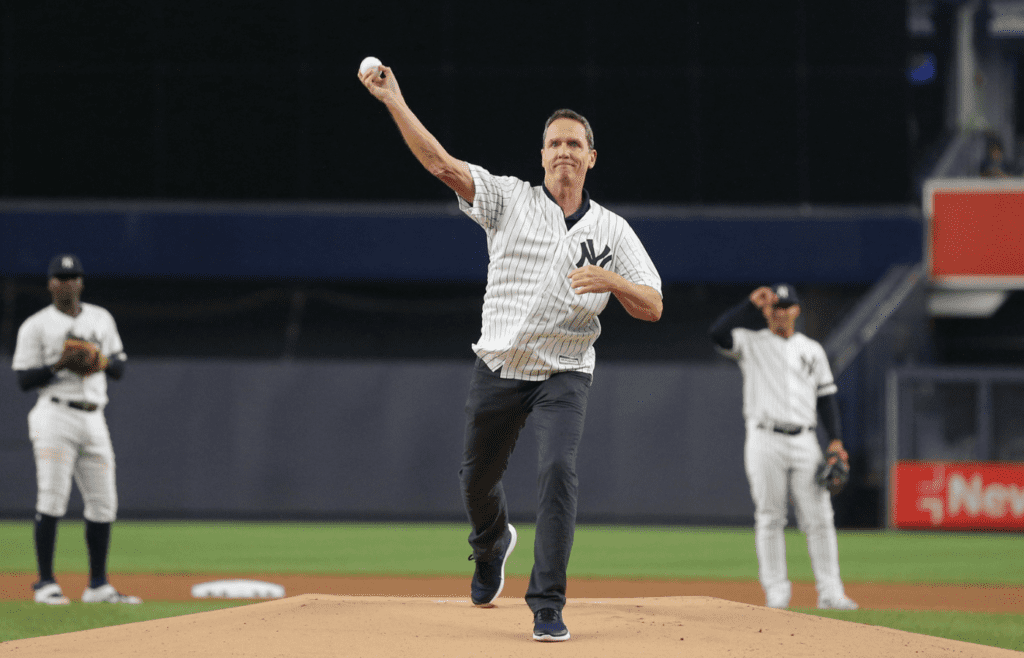 Jul 18, 2019; Bronx, NY, USA; New York Yankees former pitcher David Cone throws out the ceremonial first pitch on the twentieth anniversary of his perfect game before the second game of a doubleheader against the Tampa Bay Rays at Yankee Stadium. Mandatory Credit: Brad Penner-Imagn Images