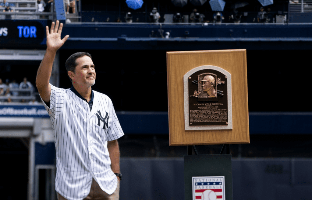 Sep 1, 2019; Bronx, NY, USA; New York Yankees former pitcher and Hall of Fame inductee Mike Mussina waves to fans prior to the game at Yankee Stadium. Mandatory Credit: Gregory J. Fisher-Imagn Images