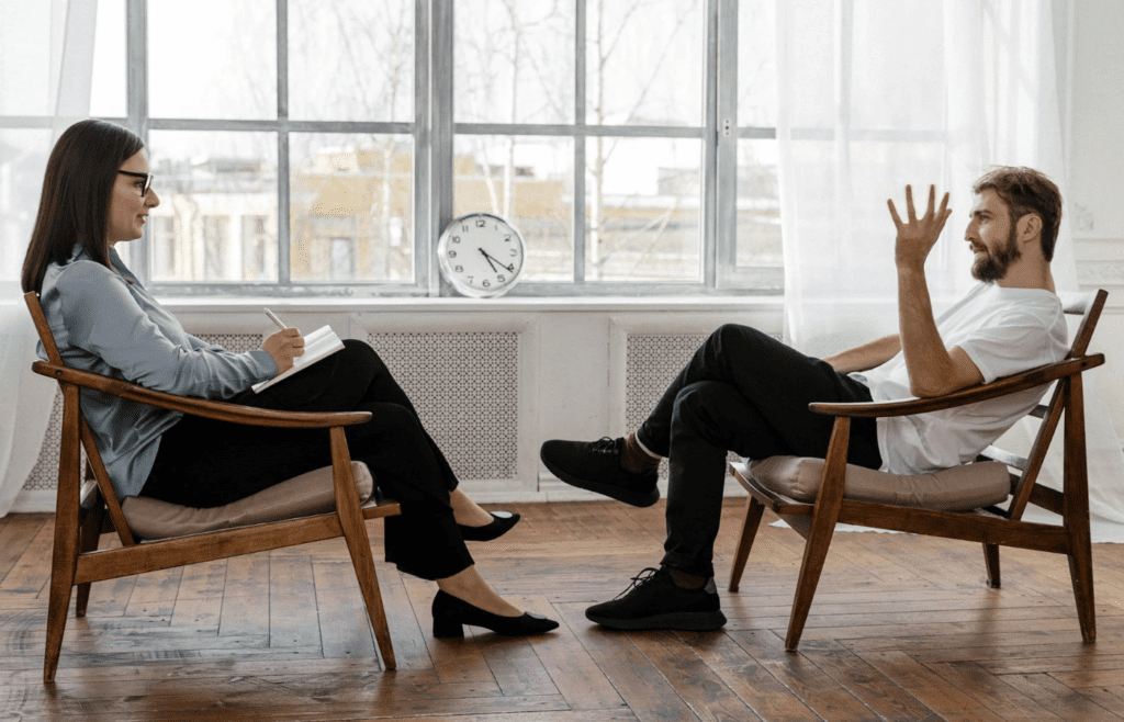 A person talking over another in a conversation