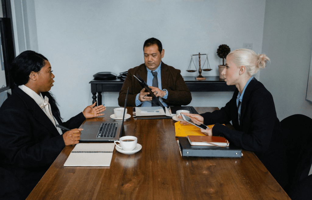 A manager speaking down to a younger employee
