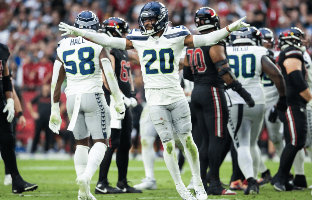 Dec 8, 2024; Glendale, Arizona, USA; Seattle Seahawks safety Julian Love (20) celebrates a missed field goal by the Arizona Cardinals in the second half at State Farm Stadium. Mandatory Credit: Mark J. Rebilas-Imagn Images