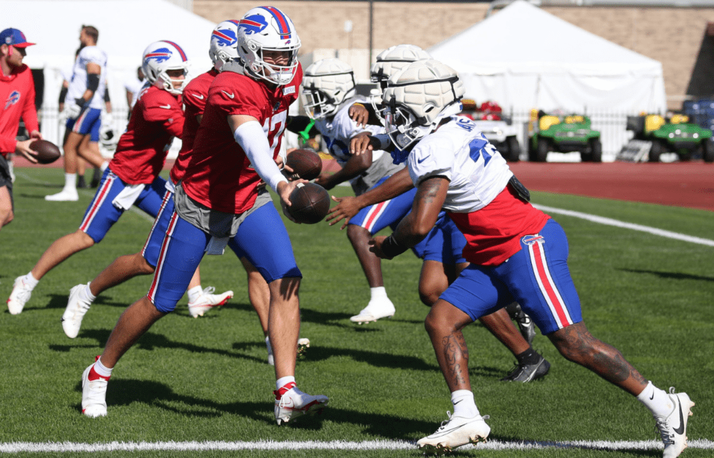 Bills quarterback Josh Allen hands off to running back Ray Davis during drills during the Buffalo Bills training camp Wednesday, Aug. 7, 2024 at St. John Fisher University
