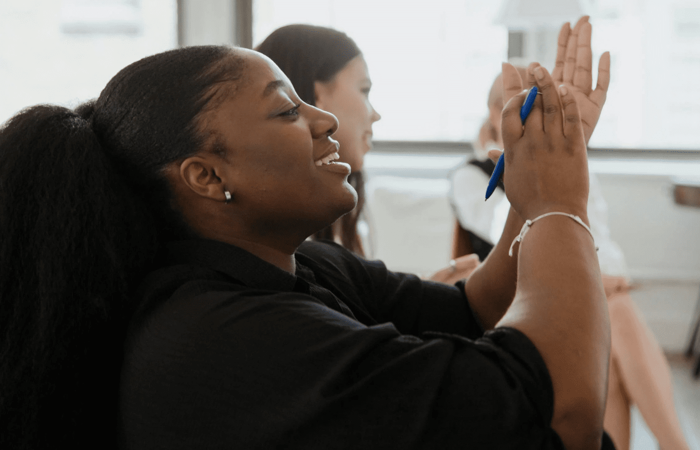 A surprised person clapping exaggeratedly