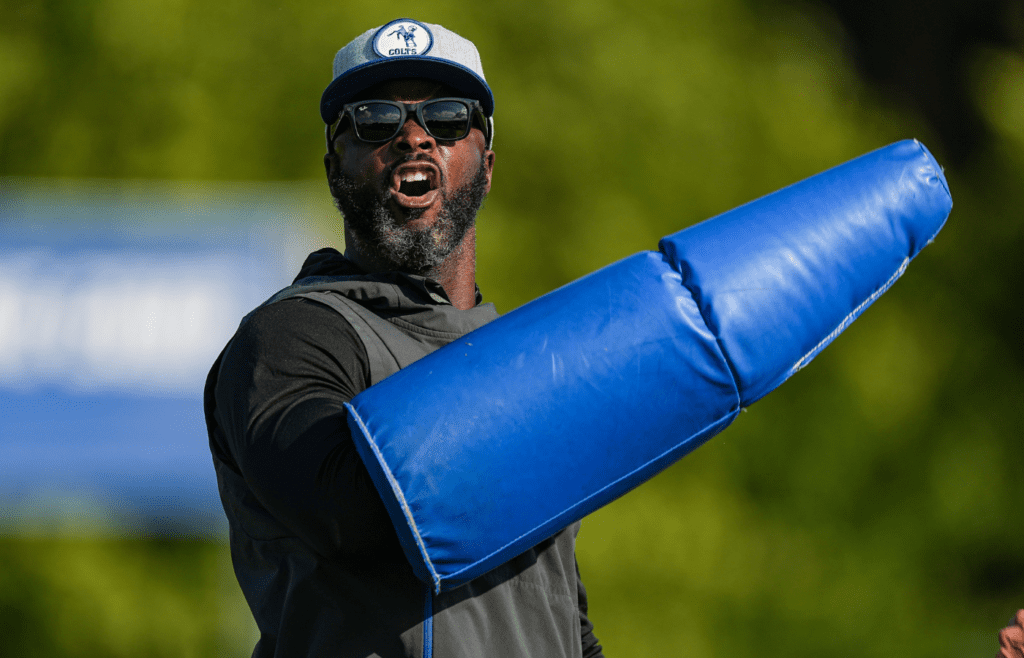 Indianapolis Colts wide receiver coach Reggie Wayne yells while helping with drills Thursday, Aug. 17, 2023, during training camp at Grand Park Sports Campus in Westfield