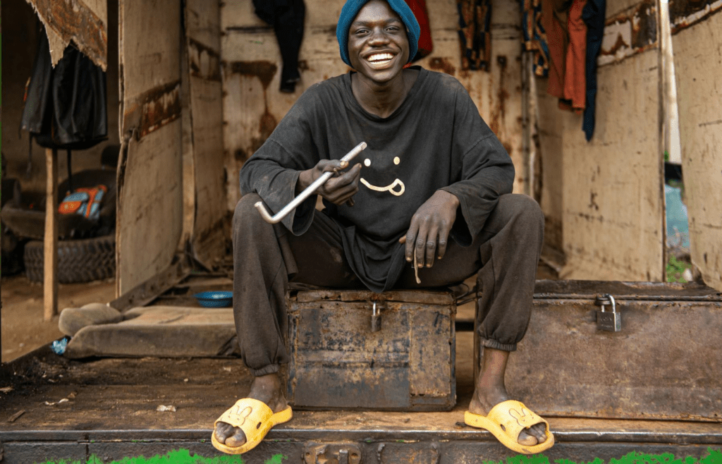 A person brushing off a hurtful comment with a grin