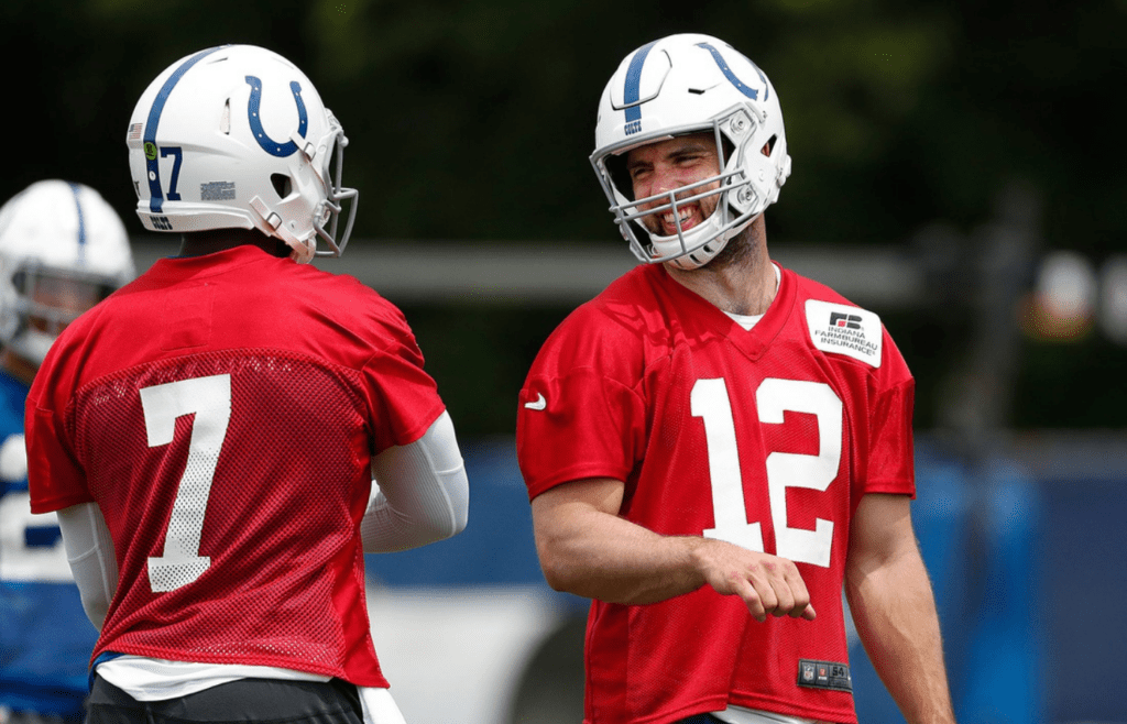 Indianapolis Colts quarterback Andrew Luck (12) shares a laugh with Jacoby Brissett (7) during their preseason training camp practice at Grand Park in Westfield on Friday, July 26, 2019. Colts Presseason Training Camp