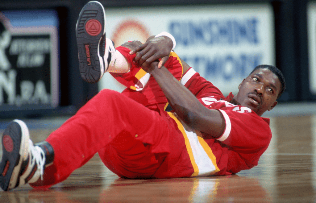 Apr 8, 1990; Orlando, FL, USA; FILE PHOTO; Houston Rockets center #34 HAKEEM OLAJUWON stretches before his game against the Orlando Magic at the Orlando Arena. Mandatory Credit: Photo By Imagn Images (c) Copyright Imagn Images