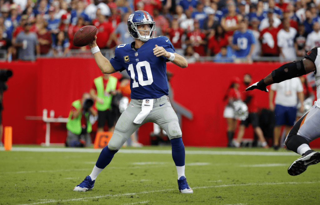 Oct 1, 2017; Tampa, FL, USA; New York Giants quarterback Eli Manning (10) throws the ball against the Tampa Bay Buccaneers during the first half at Raymond James Stadium. Mandatory Credit: Kim Klement-Imagn Images