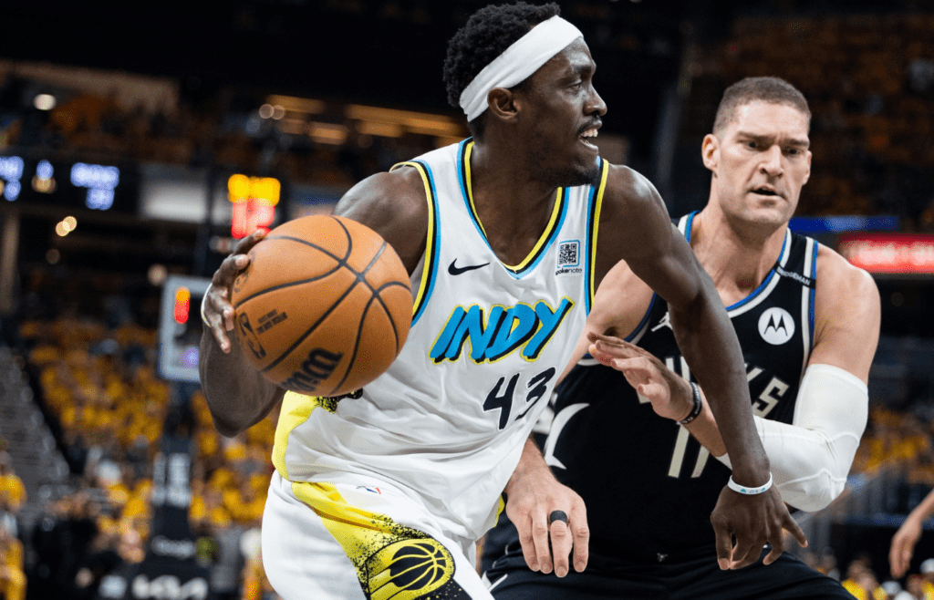 Apr 29, 2025; Indianapolis, Indiana, USA; Indiana Pacers forward Pascal Siakam (43) dribbles the ball while Milwaukee Bucks center Brook Lopez (11) defends during game five of the first round for the 2024 NBA Playoffs at Gainbridge Fieldhouse. Mandatory Credit: Trevor Ruszkowski-Imagn Images