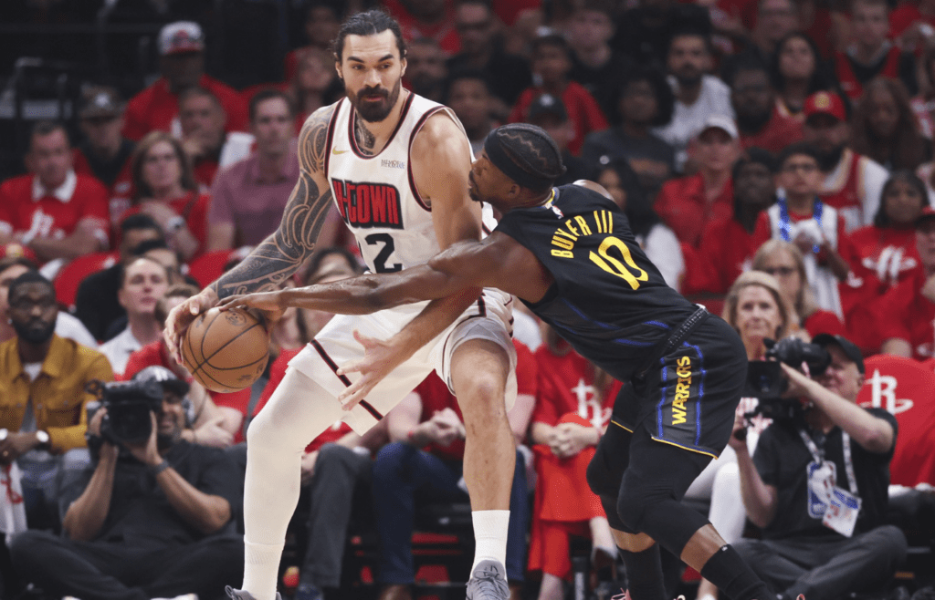 May 4, 2025; Houston, Texas, USA; Golden State Warriors forward Jimmy Butler III (10) defends against Houston Rockets center Steven Adams (12) during game seven of first round for the 2025 NBA Playoffs at Toyota Center. Mandatory Credit: Troy Taormina-Imagn Images