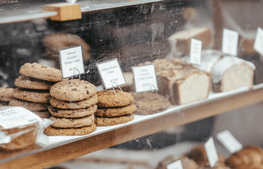 Discounted cookies and bread in bakery display case