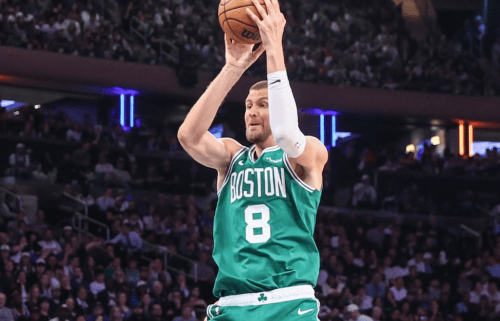 May 10, 2025; New York, New York, USA; Boston Celtics center Kristaps Porzingis (8) takes a jump shot against the New York Knicks in the third quarter during game three of the second round for the 2025 NBA Playoffs at Madison Square Garden. Mandatory Credit: Wendell Cruz-Imagn Images