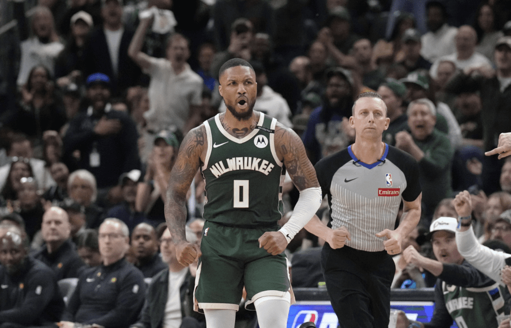 Apr 25, 2025; Milwaukee, Wisconsin, USA; Milwaukee Bucks guard Damian Lillard (0) reacts after making a basket against the Indiana Pacers in the second half during game three of first round for the 2024 NBA Playoffs at Fiserv Forum. Mandatory Credit: Michael McLoone-Imagn Images
