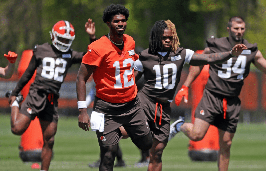 Cleveland Browns quarterback Shedeur Sanders (12) warms up with the team during NFL rookie minicamp at the Cleveland Browns training facility on Friday, May 9, 2025, in Berea, Ohio.