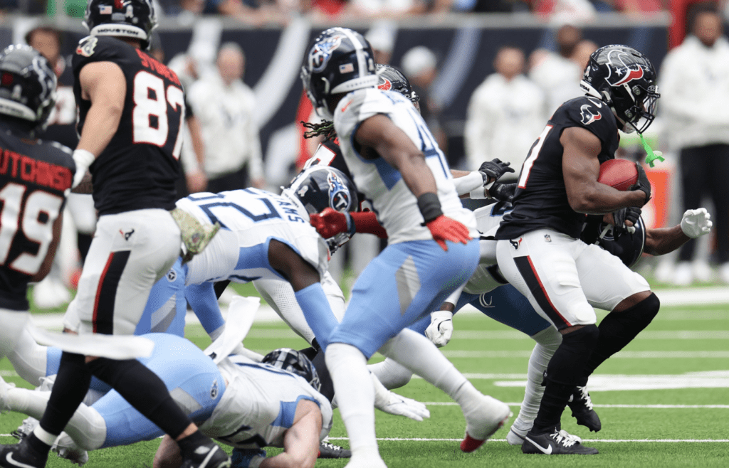 Nov 24, 2024; Houston, Texas, USA; Houston Texans special teams return man Dameon Pierce (31) returns a kickoff against the Tennessee Titans in the first quarter at NRG Stadium. Mandatory Credit: Thomas Shea-Imagn Images