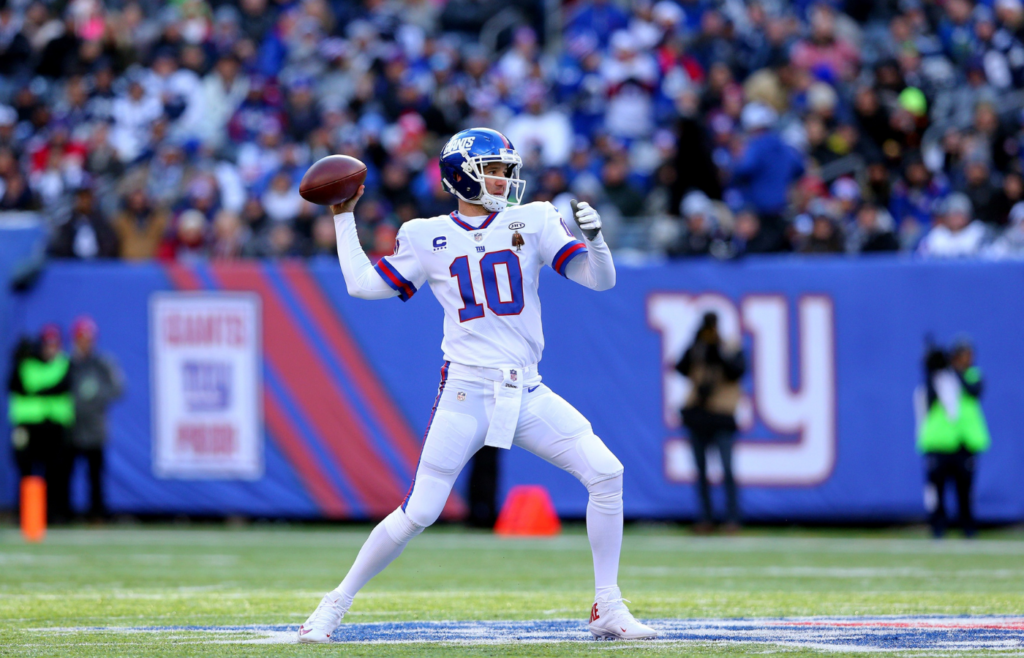 Dec 10, 2017; East Rutherford, NJ, USA; New York Giants quarterback Eli Manning (10) drops back to pass against the Dallas Cowboys during the first quarter at MetLife Stadium. Mandatory Credit: Brad Penner-Imagn Images