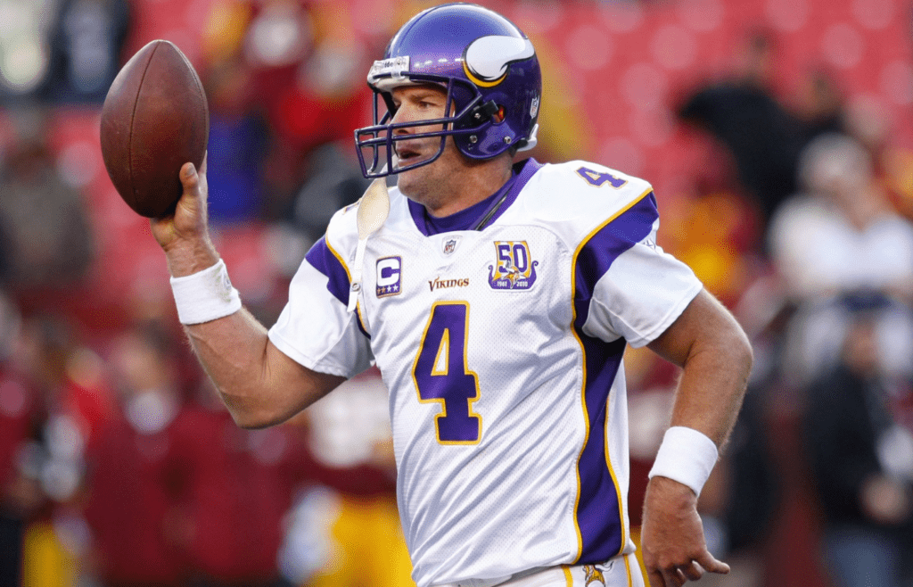 November 28, 2010; Landover, MD, USA; Minnesota Vikings quarterback Brett Favre (4) runs off the field with the ball after the Vikings game against the Washington Redskins at FedEx Field. The Vikings won 17-13. Mandatory Credit: Geoff Burke-Imagn Images