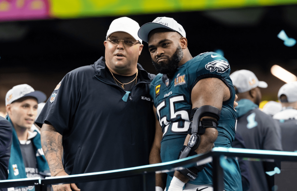 Feb 9, 2025; New Orleans, LA, USA; Philadelphia Eagles defensive end Brandon Graham (55) with team security guard Dom DiSandro after defeating the Kansas City Chiefs during Super Bowl LIX at Ceasars Superdome. Mandatory Credit: Mark J. Rebilas-Imagn Images